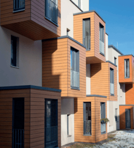 Professional installation of energy-efficient aluminum and PVC doors and windows on a commercial building.