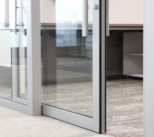 Modern exterior featuring custom aluminium and PVC doors installed by Alubenz.